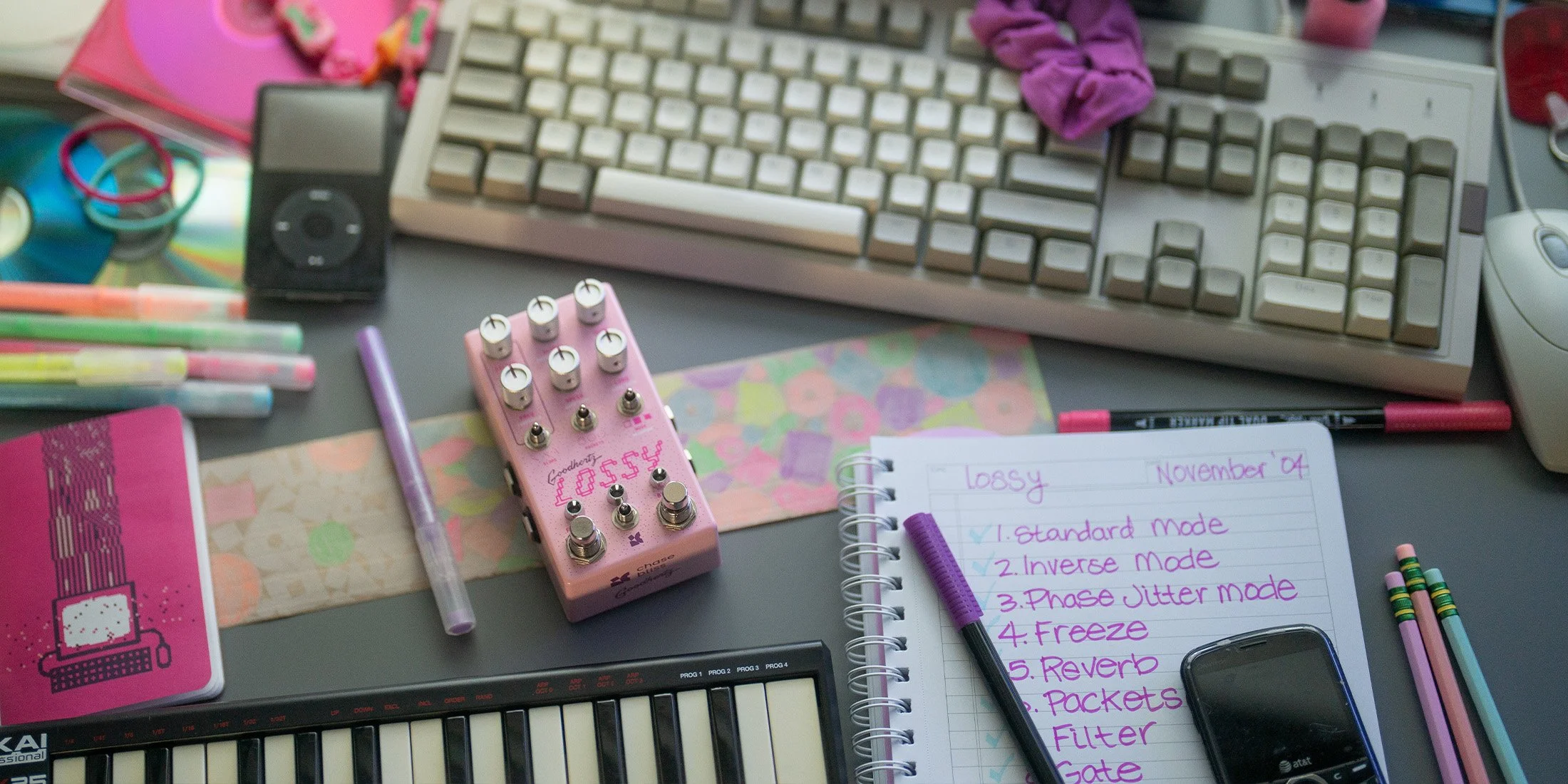 Lossy pedal by Chase Bliss and Goodhertz in a retro desk scene.