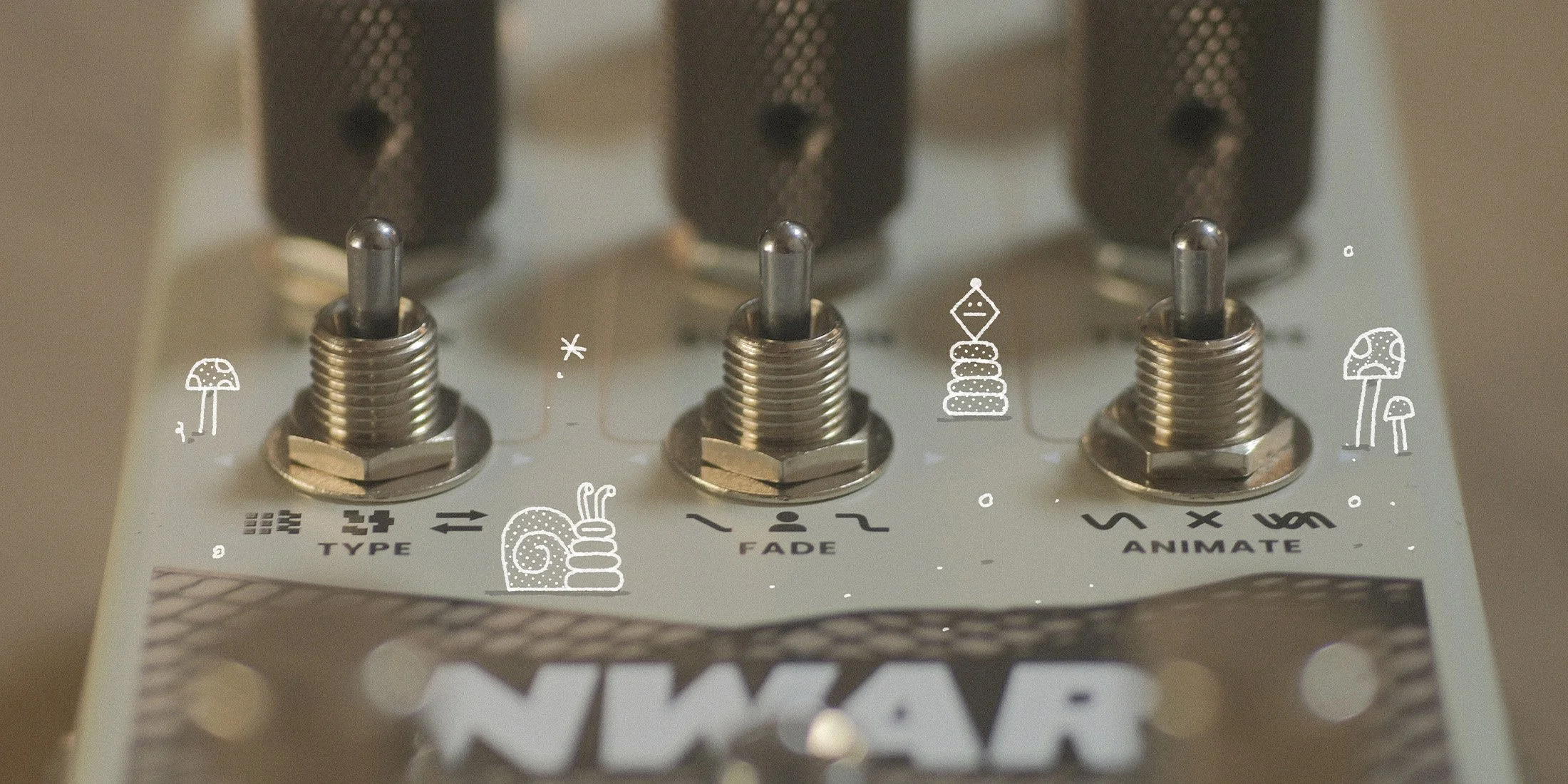 Close front facing Onward effects pedal by Chase Bliss surrounded by white chalk doodles.